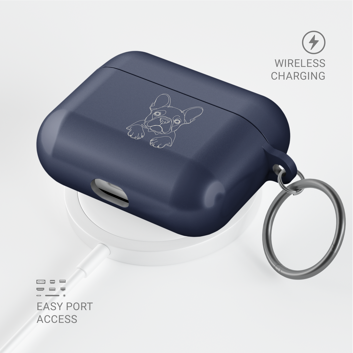Angled Midnight Blue French Bulldog AirPods case with a metal keyring, shown above a circular charging pad.