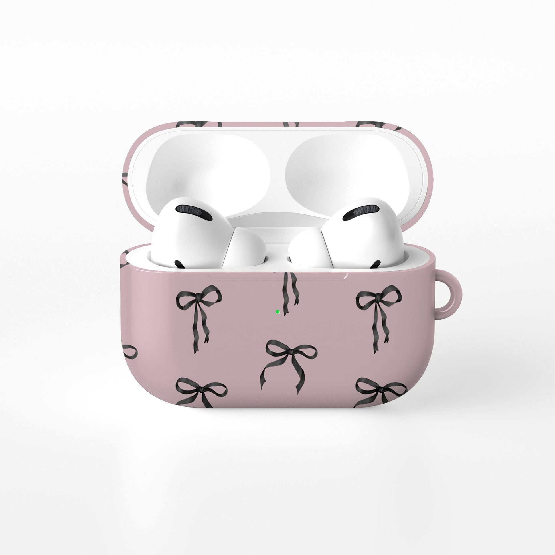 Ribbon Reverie AirPods Case – blush pink background with glossy black satin bow pattern, slim stylish protective cover for all AirPods models.