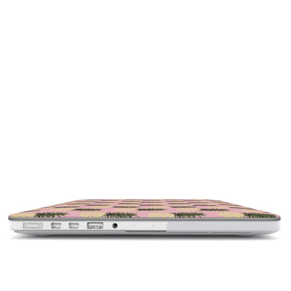 Pink pineapple MacBook case with yellow pineapple fruit print on a slim hard shell Apple MacBook cover by Case & Charm.