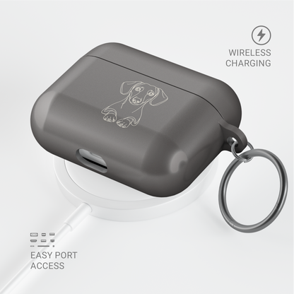 Angled Taupe Dachshund AirPods case with a metal keyring, shown above a circular charging pad.