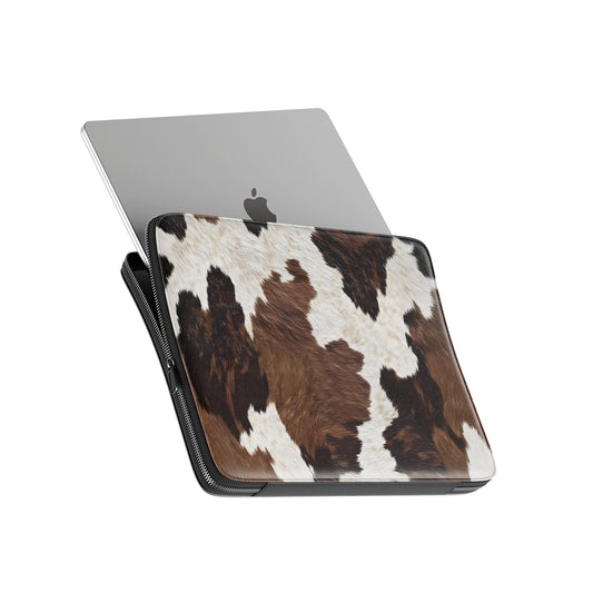 Brown and cream cow hide pattern on Hide & Seek laptop sleeve with rustic animal print texture