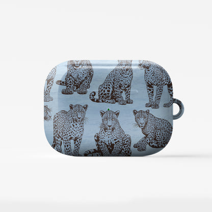 Dappled Darling AirPods Case with illustrated chocolate-brown leopards on powder blue from the Wild Atelier collection.