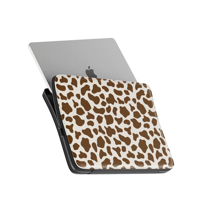Brown and cream cow print pattern on Moocha Latte laptop sleeve with soft neutral aesthetic