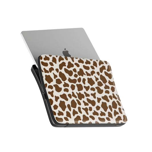 Brown and cream cow print pattern on Moocha Latte laptop sleeve with soft neutral aesthetic