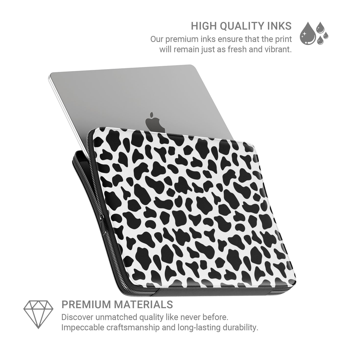 Black and white cow print pattern on Mootique Noir laptop sleeve with modern monochrome aesthetic