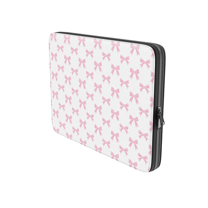 White laptop sleeve with pastel pink bow pattern and soft padded protective design