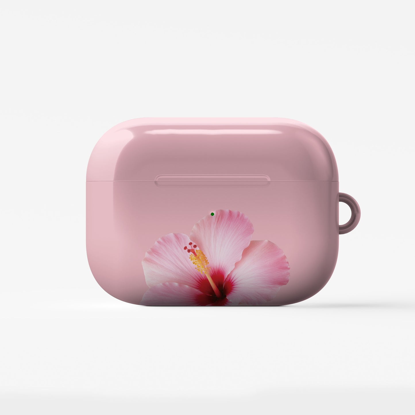 Pink hibiscus AirPods case with soft floral tropical print on a glossy Apple AirPods case by Case & Charm