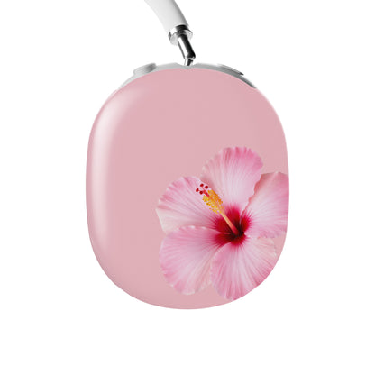 Pink hibiscus AirPods Max case with soft blush floral print on glossy headphone ear cup covers by Case & Charm.