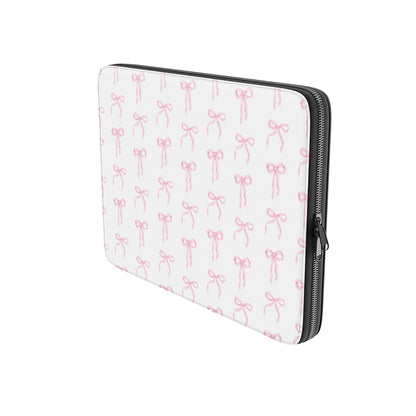 White laptop sleeve with blush pink ribbon bow pattern and padded protective design