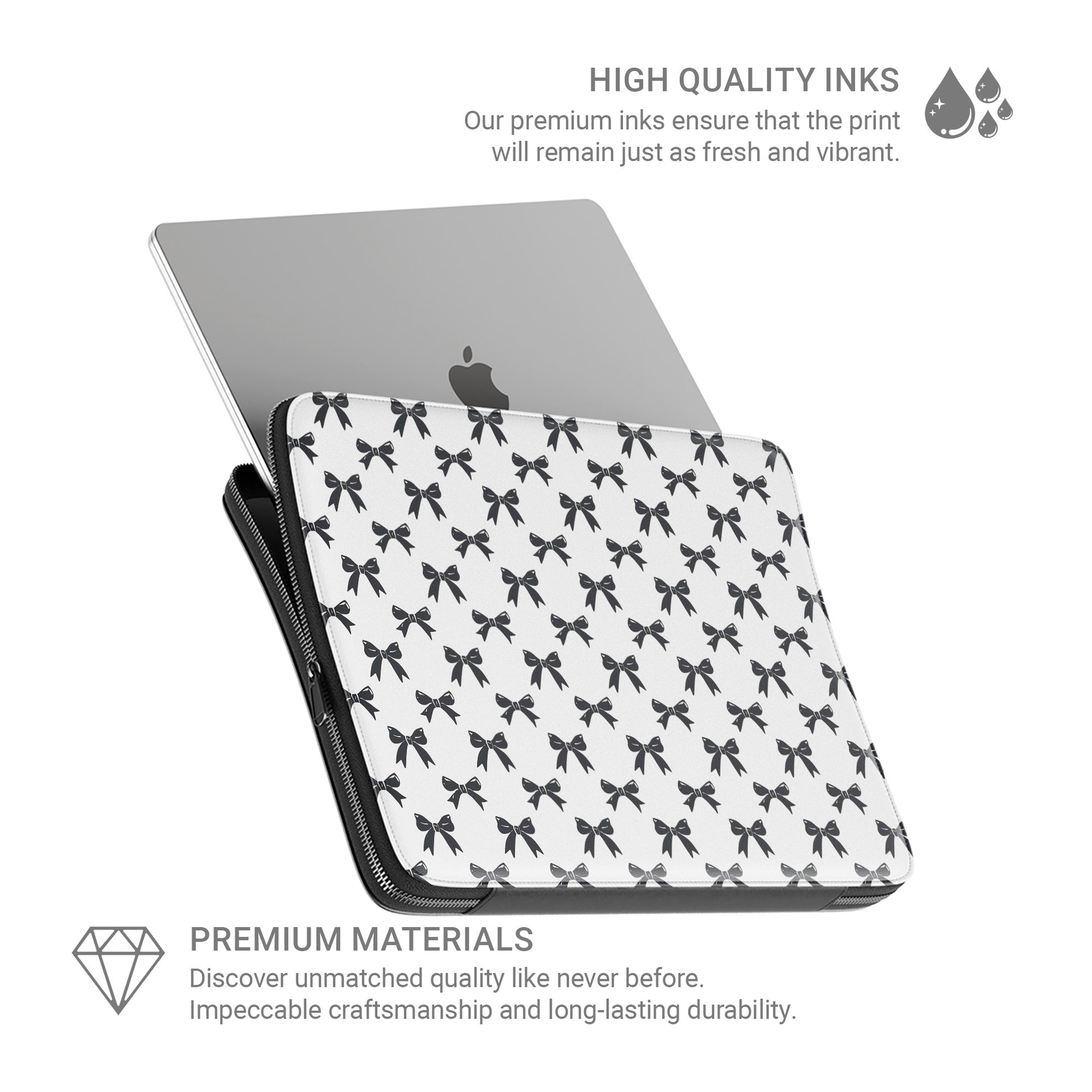 White laptop sleeve with black bow pattern and padded protective design