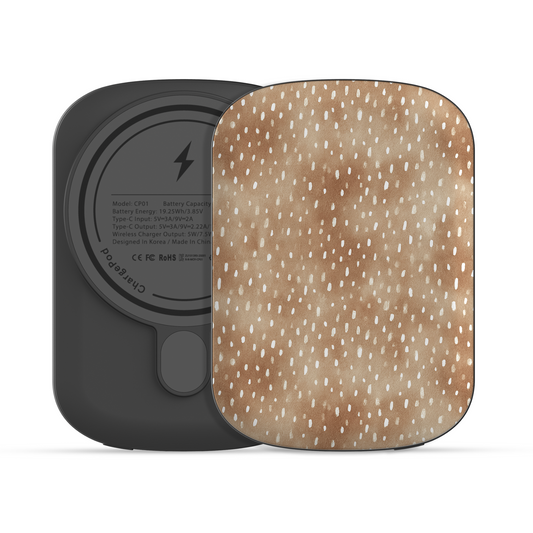 Fawn Fleck power bank in warm beige with irregular tan speckles and organic abstract marks.