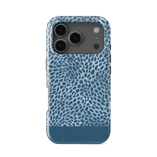 Poppy Blue Tough Phone Case with deep blue animal spots scattered over powder blue from the Wild Atelier collection.
