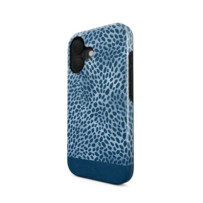 Poppy Blue Tough Phone Case with deep blue animal spots scattered over powder blue from the Wild Atelier collection.

