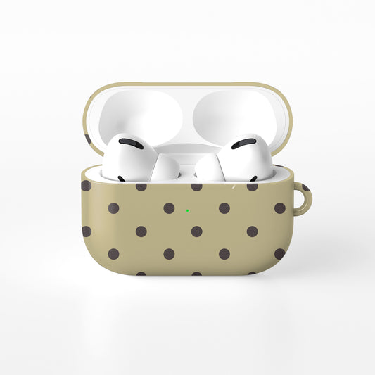 Cocoa Drops AirPods Case featuring small, evenly spaced cocoa-brown polka dots on a creamy vanilla background.