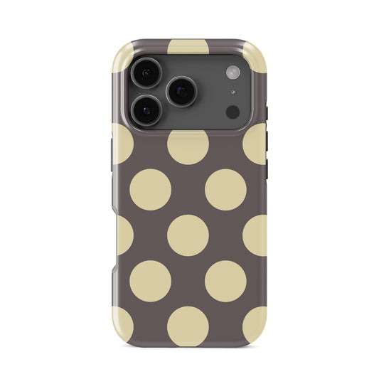 Strawberry Drops Tough Phone Case featuring small strawberry-pink polka dots on a rich cocoa-brown background.