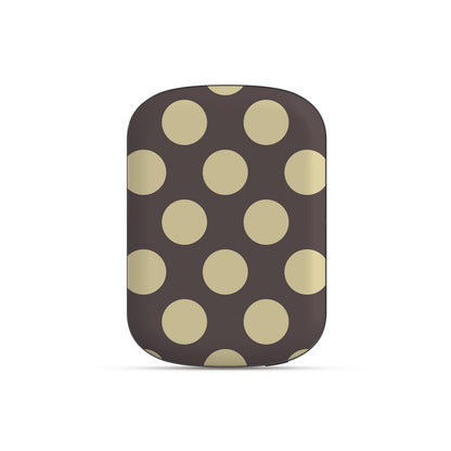 Vanilla Truffle Power Bank Shell featuring oversized creamy vanilla polka dots on a rich cocoa-brown background.