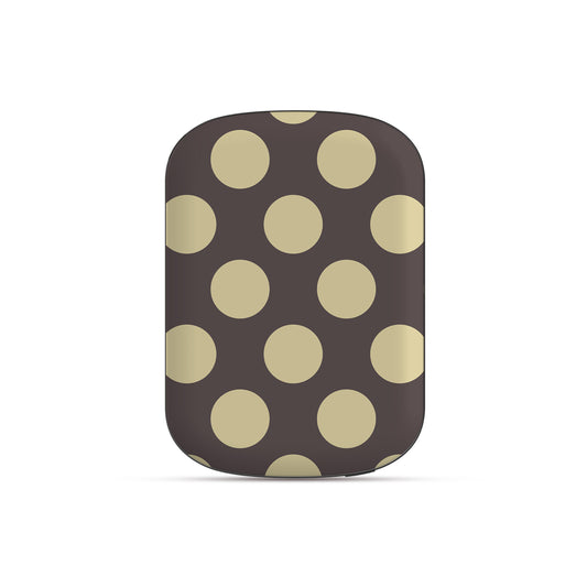 Vanilla Truffle Power Bank Shell featuring oversized creamy vanilla polka dots on a rich cocoa-brown background.