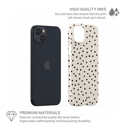 Cream snap phone case with scattered black dot pattern and minimal polka dot design