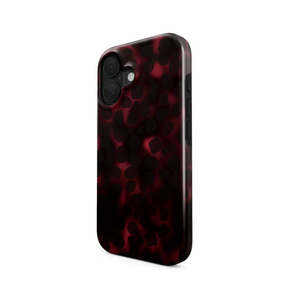 Crimson Ember MagSafe tough phone case with deep red marble tortoise Shell design, dual layer build, and magnetic charging compatibility.