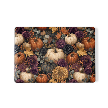Autumn Garden MacBook shell with cream pumpkins, burgundy flowers and trailing foliage on a dark botanical background.