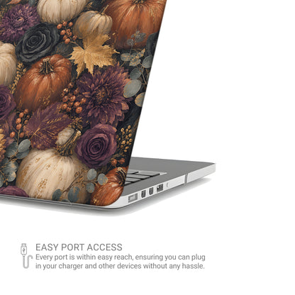 Autumn Garden MacBook shell with cream pumpkins, burgundy flowers and trailing foliage on a dark botanical background.