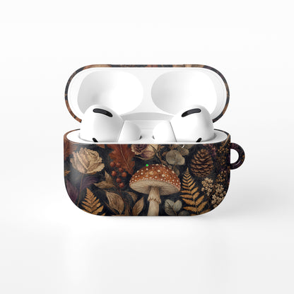 Woodland Forage AirPods case with mushrooms, ferns, pinecones and botanical foliage on a dark woodland background.