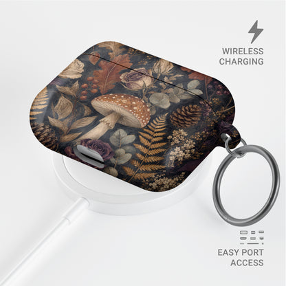 Woodland Forage AirPods case with mushrooms, ferns, pinecones and botanical foliage on a dark woodland background.