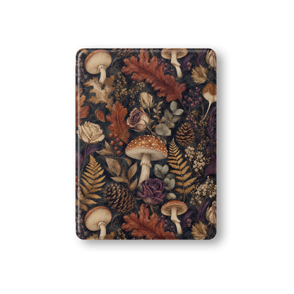 Woodland Forage iPad case with mushrooms, ferns, pinecones and botanical foliage on a dark woodland background.