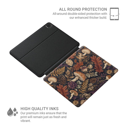 Woodland Forage iPad case with mushrooms, ferns, pinecones and botanical foliage on a dark woodland background.