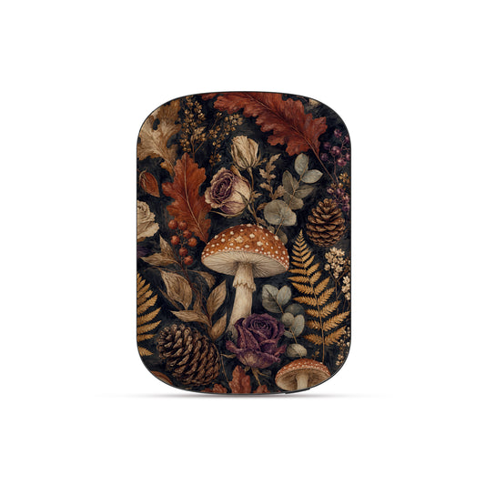 Woodland Forage power bank with mushrooms, ferns, pinecones and botanical foliage on a dark woodland background.