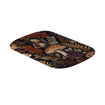 Woodland Forage interchangeable power bank shell featuring mushrooms, ferns, pinecones and botanical foliage on a dark woodland background.