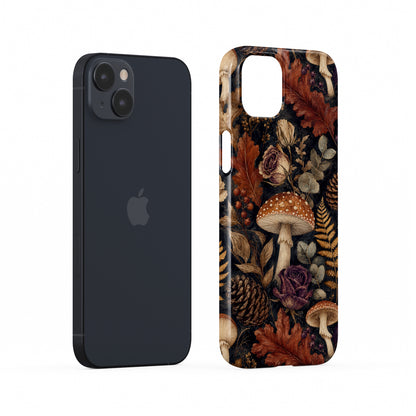 Woodland Forage Snap phone case with mushrooms, ferns, pinecones and botanical foliage on a dark woodland background.