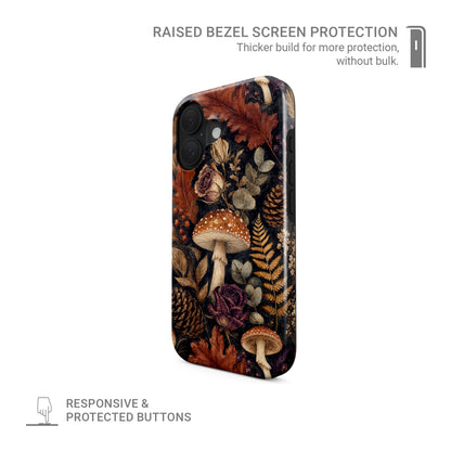 Woodland Forage Tough phone case with mushrooms, ferns, pinecones and botanical foliage on a dark woodland background.