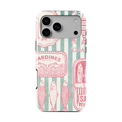 Pink sardine MagSafe tough phone case design with retro fish tins, illustrated sardines and teal coastal stripe background.