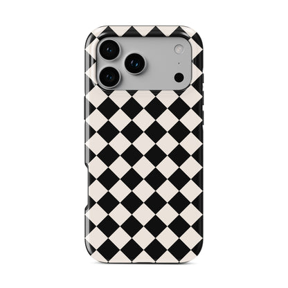 Black and cream harlequin checkerboard tough phone case with bold diamond pattern and glossy finish