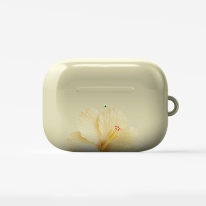 Yellow hibiscus AirPods case with soft lemon floral print on a glossy Apple AirPods case by Case & Charm.