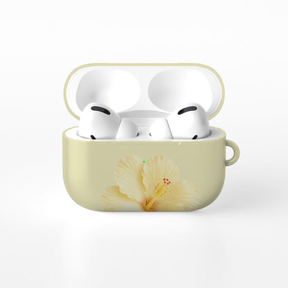 Yellow hibiscus AirPods case with soft lemon floral print on a glossy Apple AirPods case by Case & Charm.
