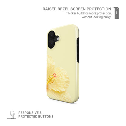Yellow floral MagSafe phone case featuring a large cream hibiscus bloom on a pale lemon background with a soft tropical botanical look.