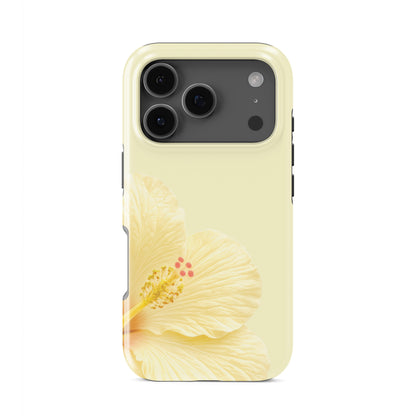 Yellow floral tough phone case featuring a cream hibiscus flower on a pale lemon background with a soft tropical botanical style.