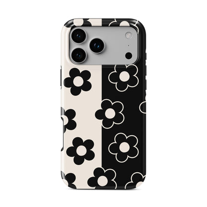 Black and cream split floral phone case with bold petal pattern, retro flower design, glossy finish tough protective phone case