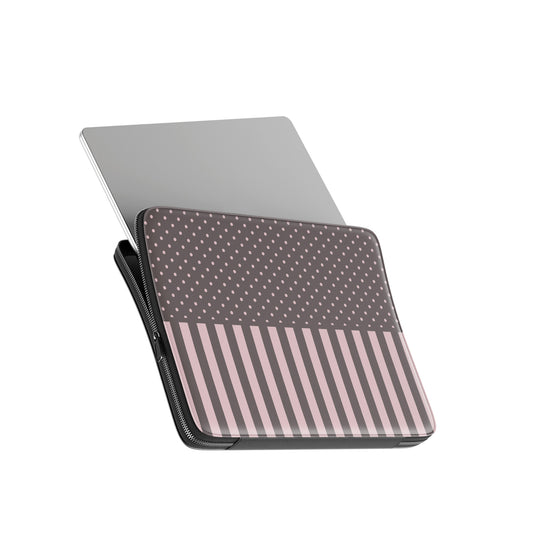 Strawberry Wafer Laptop Sleeve featuring fine strawberry-pink polka dots above bold vertical strawberry-pink stripes on a cocoa-brown background.