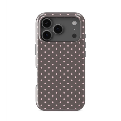 Strawberry Drops Tough Phone Case featuring small strawberry-pink polka dots on a rich cocoa-brown background.