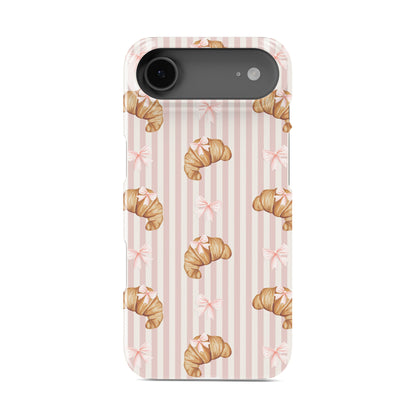 pink croissant phone case with bow pattern on blush stripe background cute aesthetic iphone 15 case bakery style design