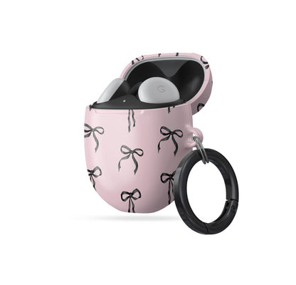 Burga Google Pixel Buds case in Ribbon Reverie design with black satin bows on a blush-pink background, slim and stylish coquette-inspired cover.