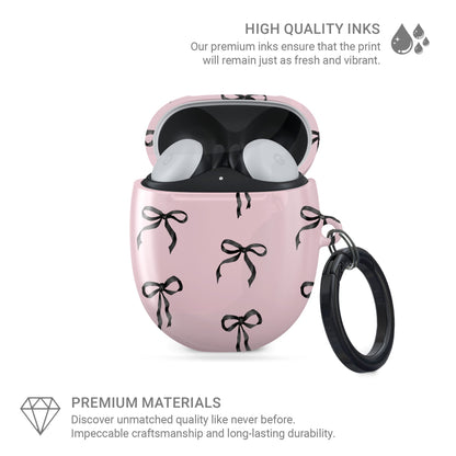 Burga  Google Pixel Buds case in Ribbon Reverie design with black satin bows on a blush-pink background, slim and stylish coquette-inspired cover.