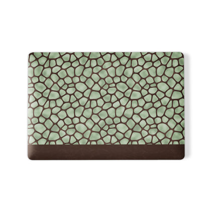 Mossy Mosaic MacBook Case with sage green giraffe spots outlined in chocolate brown from the Wild Atelier collection.