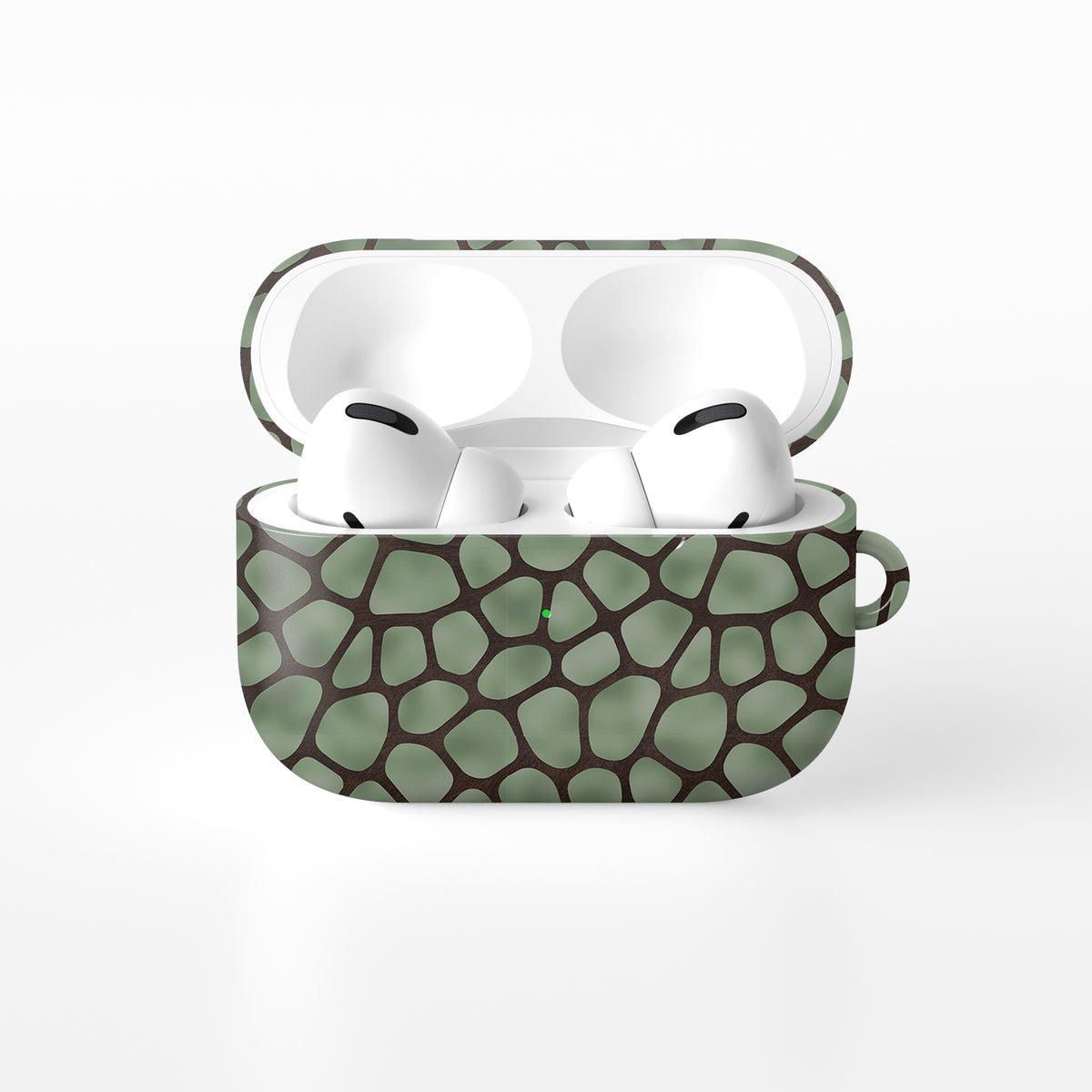 Mossy Mosaic AirPods Case with sage green giraffe spots outlined in chocolate brown from the Wild Atelier collection.