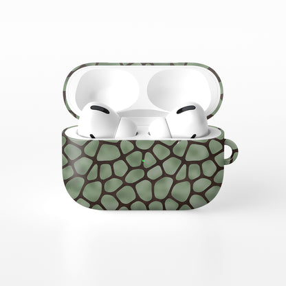 Mossy Mosaic AirPods Case with sage green giraffe spots outlined in chocolate brown from the Wild Atelier collection.