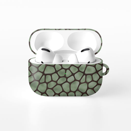 Mossy Mosaic AirPods Case with sage green giraffe spots outlined in chocolate brown from the Wild Atelier collection.