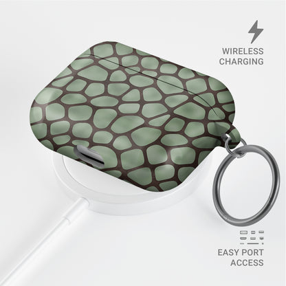 Mossy Mosaic AirPods Case with sage green giraffe spots outlined in chocolate brown from the Wild Atelier collection.